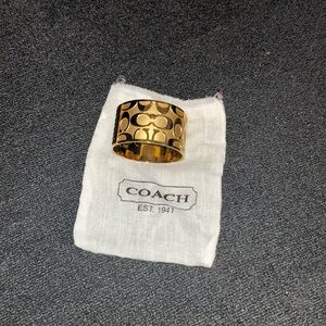 COACH Gold-Tone Signature Cuff Bracelet